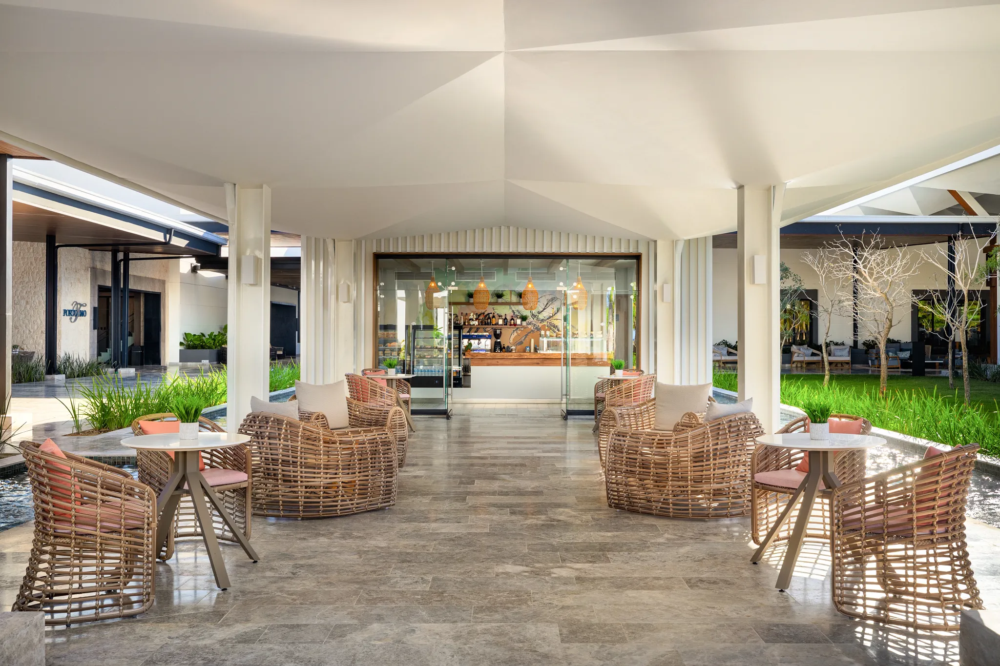 Coco Café at Secrets Tides Punta Cana featuring a cozy coffee bar with premium espresso drinks, pastries, and casual lounge seating.