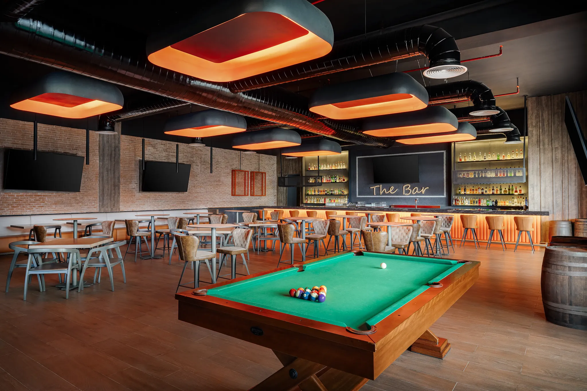 Desires Sports Bar at Secrets Tides Punta Cana featuring a lively lounge atmosphere, big-screen TVs, and evening entertainment.