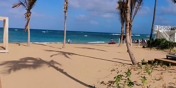 Gazebo beach area with palm-lined shoreline at Secrets Tides Punta Cana