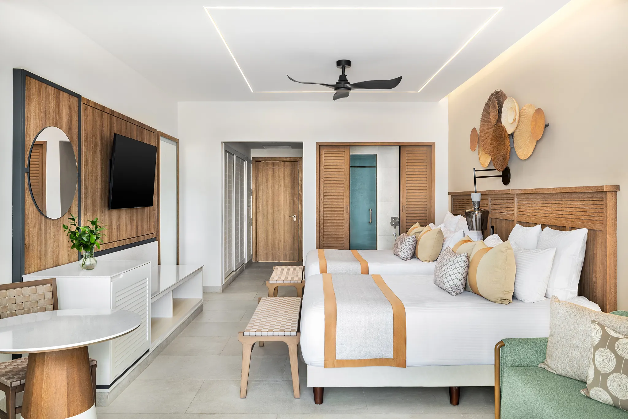 Junior Suite Garden View with two double beds and modern tropical décor at Secrets Tides Punta Cana.