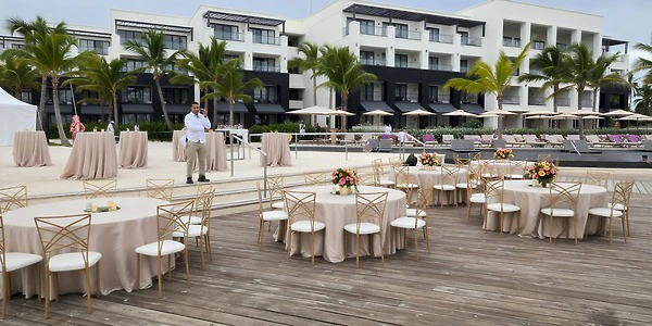 Pool deck wedding reception setup with resort views at Secrets Tides Punta Cana