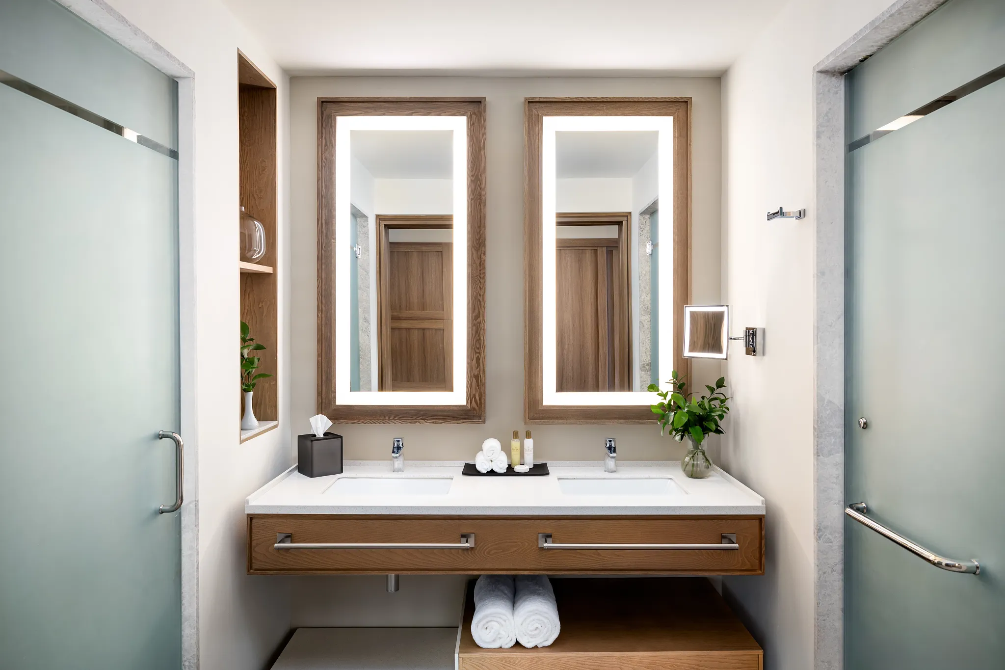 Preferred Club Junior Suite Partial Ocean bathroom with double sinks and glass-enclosed shower at Secrets Tides Punta Cana.