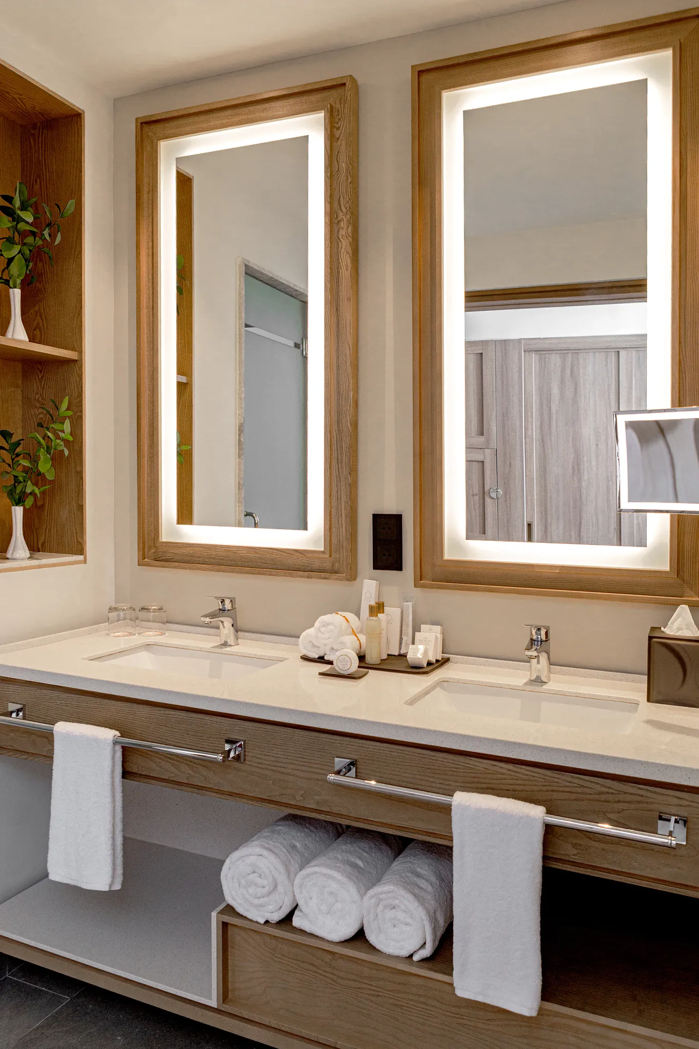 Double sink vanity with backlit mirrors in Preferred Club Junior Suite Tropical View at Secrets Tides Punta Cana.