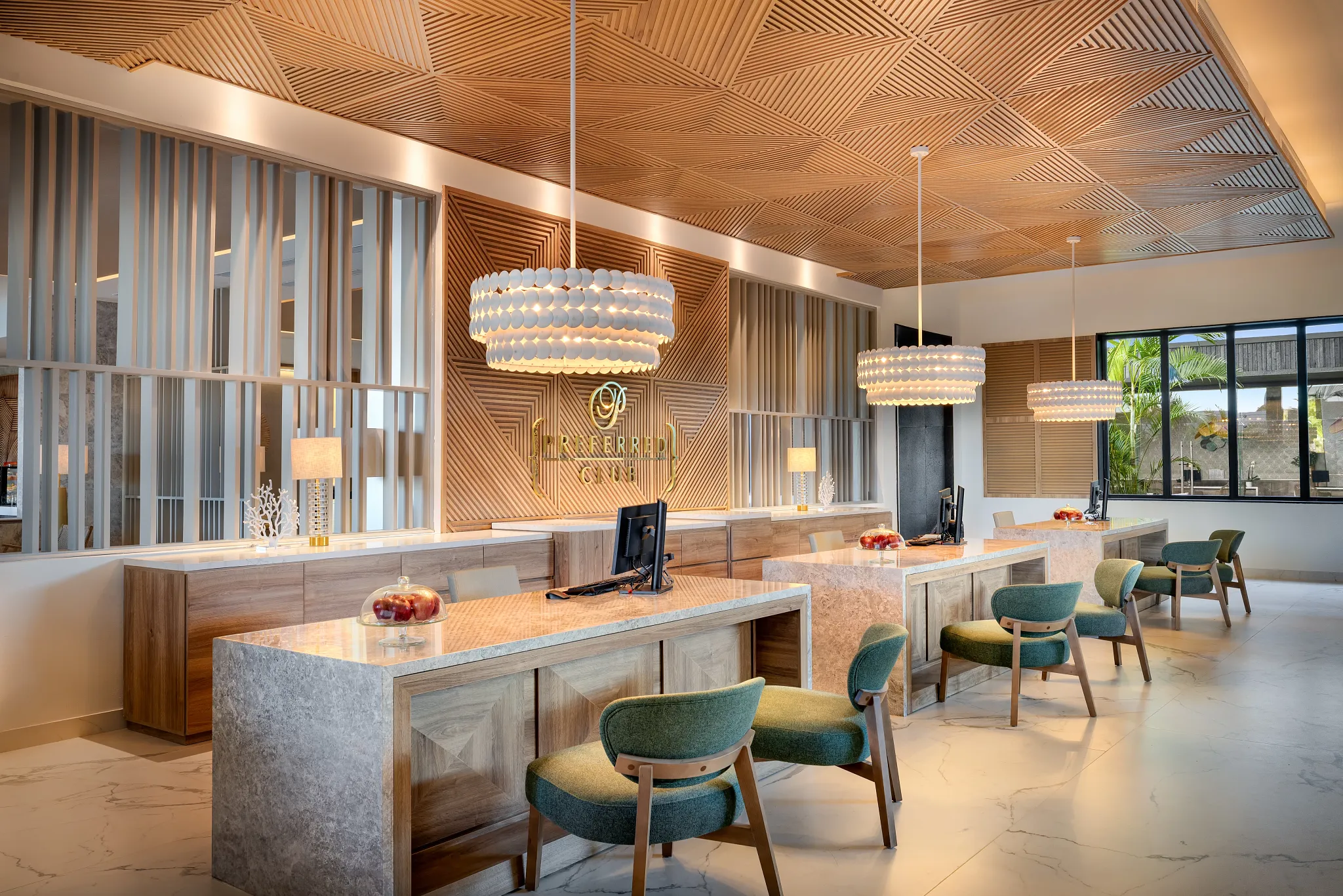 Preferred Club reception desk at Secrets Tides Punta Cana featuring elegant wood design and personalized concierge service for upgraded guests.