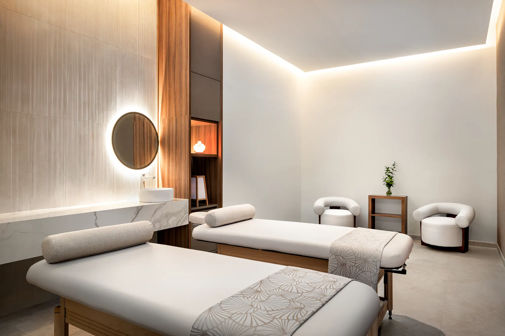 Couples massage treatment room at Secrets Tides Punta Cana spa with serene lighting and modern design for relaxation.